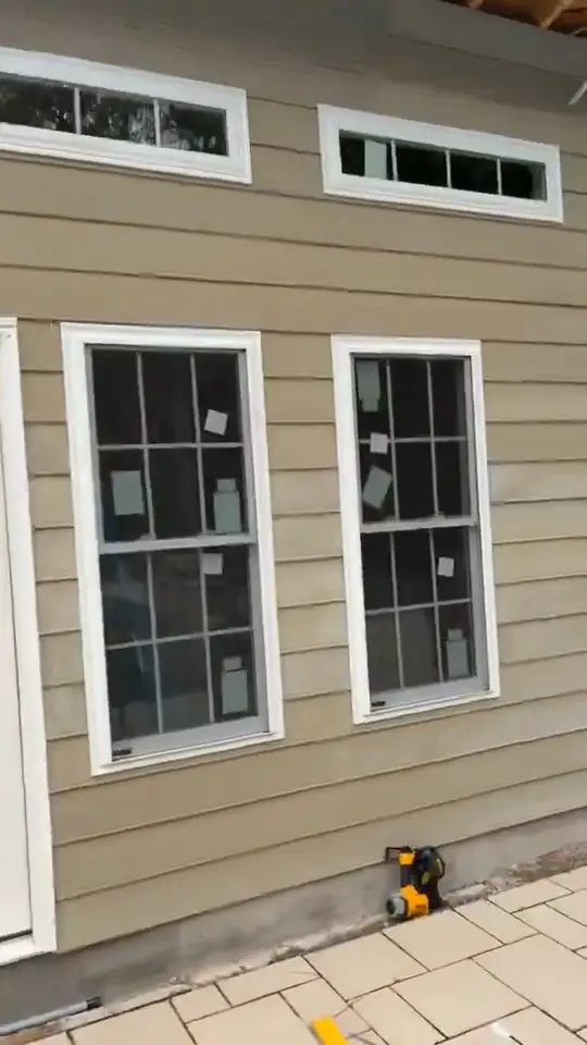 Pool house siding, window, and door installation — video 1